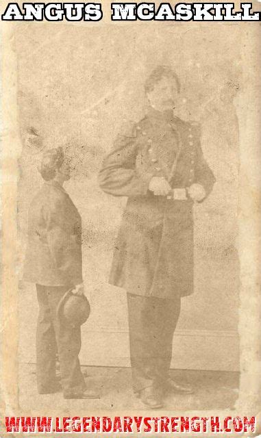 An Old Photo Of Two Men Standing Next To Each Other