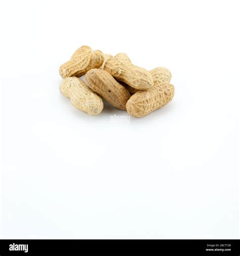 Bunch Of Peanuts Isolated On White Stock Photo Alamy