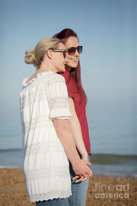 Lesbian Couple Holding Hands On Beach Photograph By Caia Imagescience