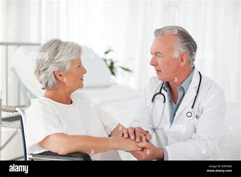 Doctor Speaking With His Patient Stock Photo Alamy