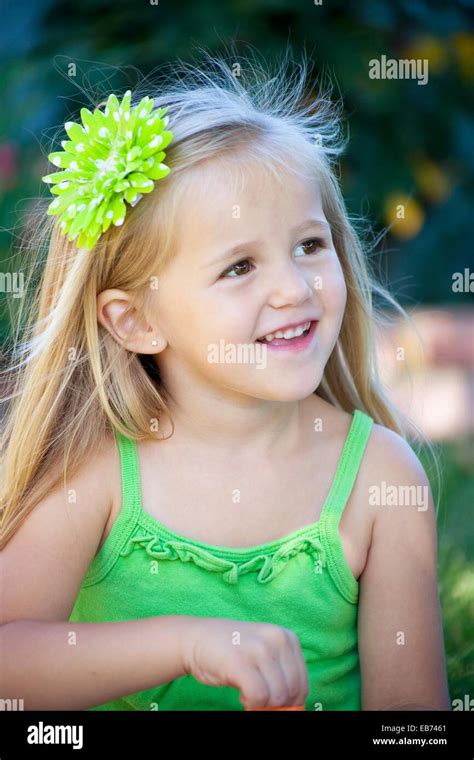 Beautiful Little Girl In Green Stock Photo Alamy
