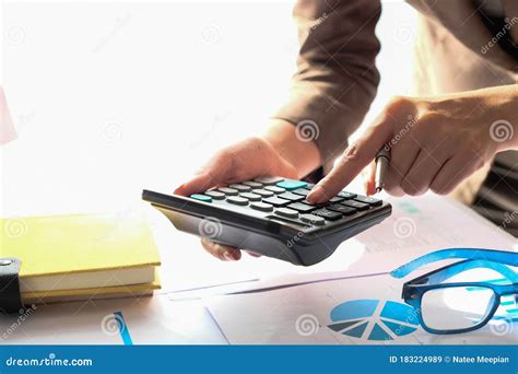 Close Up Accountant Using Calculator For Calculating Financial Expense