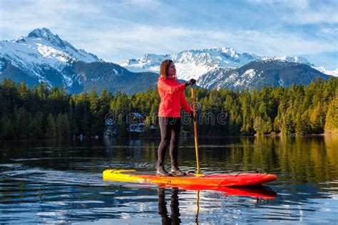 Beautiful Woman Paddle Boarding Scenic Mountain Lake Stock Photos