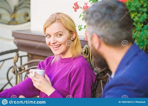 woman and man with beard relax in cafe first meet of girl and mature man morning coffee