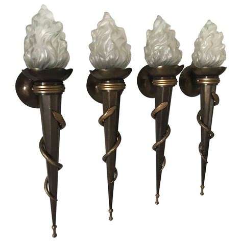 All in all, art deco wall sconces run the gambit of different design characteristics, and because they often transform elements of other styles, they pair well with a variety of other lighting options. Two Pair of Rare Large Swedish Art Deco Torch Wall Sconces Totally Four Pieces | From a unique ...