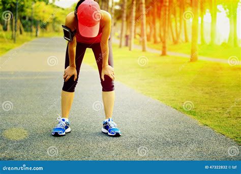 Tired Woman Runner Taking A Rest After Running Hard Stock Photo Image