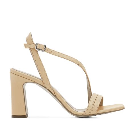 crossover heeled sandals in beige leather andrés machado