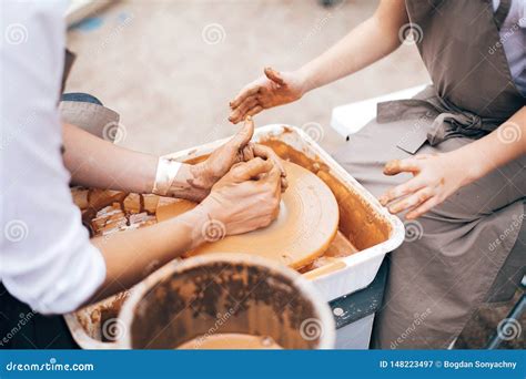 Pottery Workshop Hands Of Adult And Child Making Pottery Working With