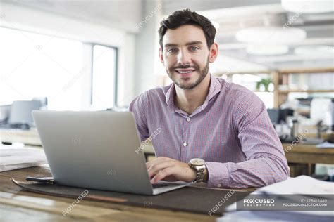 Male Office Worker Working With Laptop In Office — Technology Project