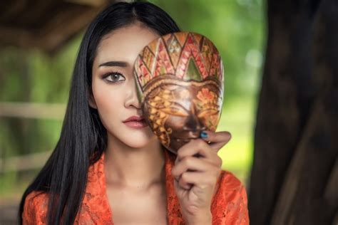 premium photo beautiful balinese women in traditional costumes with mask culture of bali