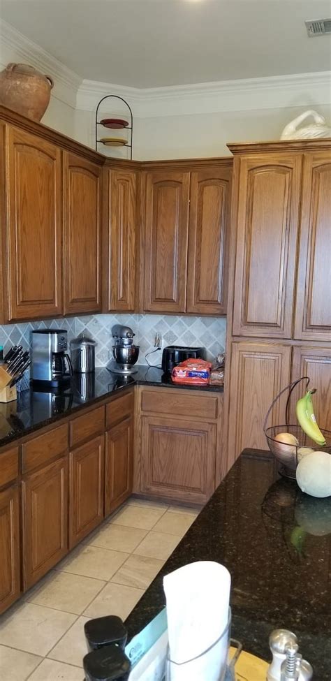 How do you all feel about the black painted door, wall and backside of the island. Kitchen Cabinet Faux Painting Transformation | SurePro ...