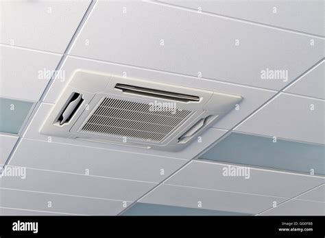 Office Ceiling With Air Conditioner And Fluorescent Lamps Stock Photo