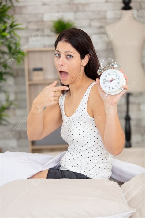 Shocked Young Woman Waking Up With Alarm Photo Background And Picture