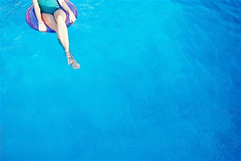 Teen Girls Legs In Floatie In Blue Swimming Pool By Wendy Laurel