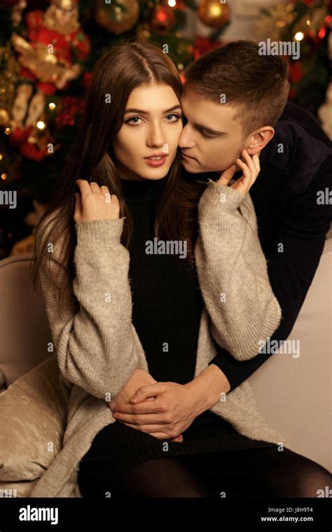 Young Romantic Cute Couple Staing At Home And Enjoying Time Together Lovers Hugging In Cristmas