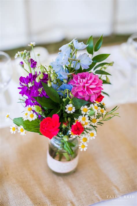 Colourful jam jars wedding table centre | Wedding table centres, Jam