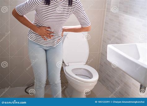 Woman With Diarrhea Standing In The Bathroom Holding Her Stomach Severe Stomach Pain Prepare
