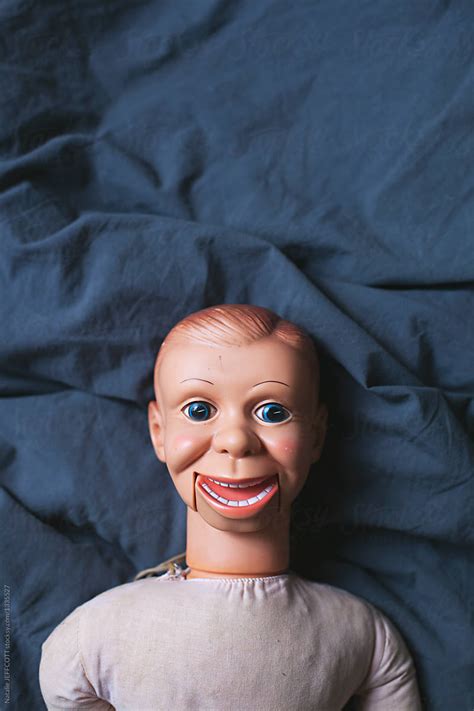 Creepy Talking Doll Lying On A Bed By Stocksy Contributor Natalie Jeffcott Stocksy