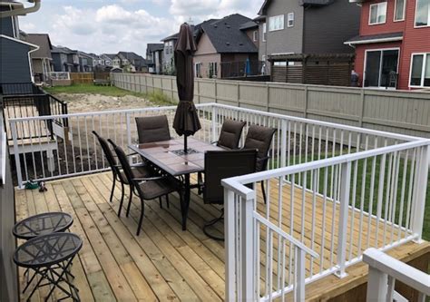 Rocky View Yards Landscaping Deck With Metal Railing