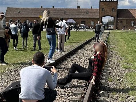 Tourist Slammed For ‘sexy Pose On Auschwitz Railway Tracks