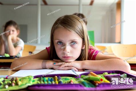 Portrait Of Bored Schoolgirl At Class Stock Photo Picture And Royalty