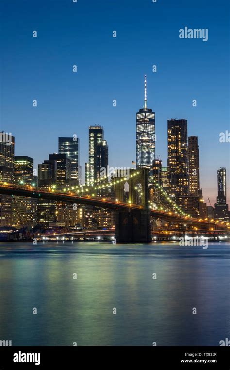 The Brooklyn Bridge East River And Manhattan Skyline At Night New