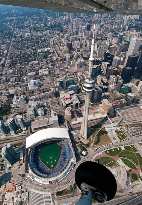 Cn Tower As It Stands Next To Rogers Centre Home Of The Blue Jays