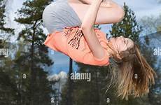 trampoline girl jumping young down alamy teenage upside action stock freeze model release