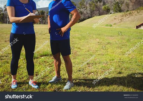 Mide Section Female Trainer Instructing Man Stock Photo 631004093
