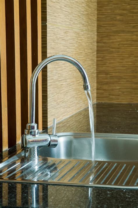 Water Running From Tap Of Sink Stock Photo Image Of Design Counter