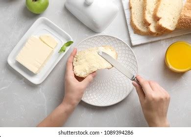 Woman Spreading Butter On Slice Bread Stock Photo Shutterstock