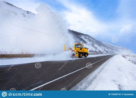 Yellow Snowplow Truck Or Snow Removal Truck With Snowplow Blade Is