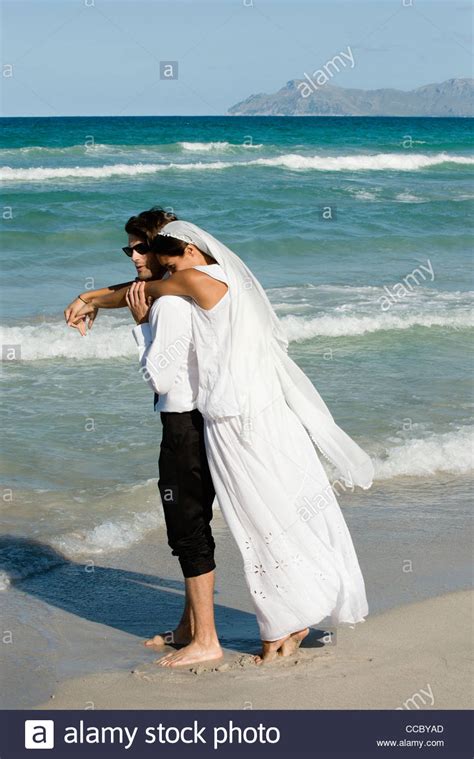 Bride And Groom Embracing At The Beach Stock Photo Alamy