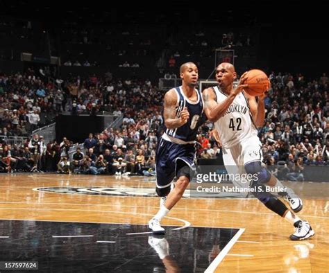 Jerry Stackhouse Of The Brooklyn Nets Dribbles Against Eric Maynor Of