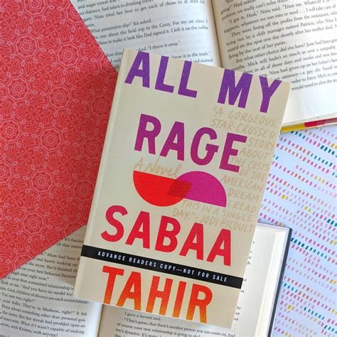 a photo of the arc of all my rage sitting on two open hardcover books with orange and pink