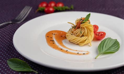Gourmet Spaghetti Beautifully Arranged On A White Plate 1900388 Stock