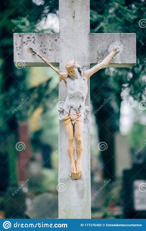 Picture Of Old Wooden Or Stone Cross With Figure Of Crucified Jesus