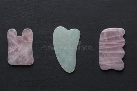 Tools For Massage Of Face Body Natural Stones Mineral Rose Quartz White Jade Lie On Black