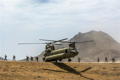 Army Reservist Off Load From A Ch 47 Chinook Helicopter Conducting An