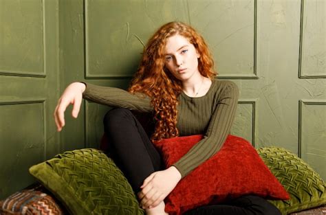 Premium Photo Curly Redhead Girl Relaxing On Comfortable Soft Sofa