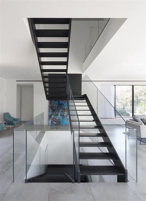 The principal function of the railings is to offer safety and prevent people from falling off the surfaces of the stairways. Simple Modern House with an Amazing Floating Stairs - Architecture Beast