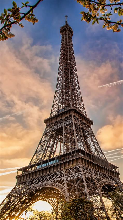Paris Eiffel Tower France With Background Of Blue Sky And Clouds During