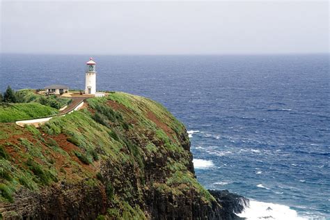 So, if one tired of looking down into the ravine, a view of the greenery along the ridgeline would be waiting through an adjacent window. Lighthouse on a Cliff Kileaua Lighthouse Photograph by ...