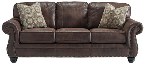Burgundy leather sofas, sectionals, and armchairs are a classic way to upgrade the style of a den, home office, living room, or family room. Faux Leather Sofa with Rolled Arms and Nailhead Trim by ...