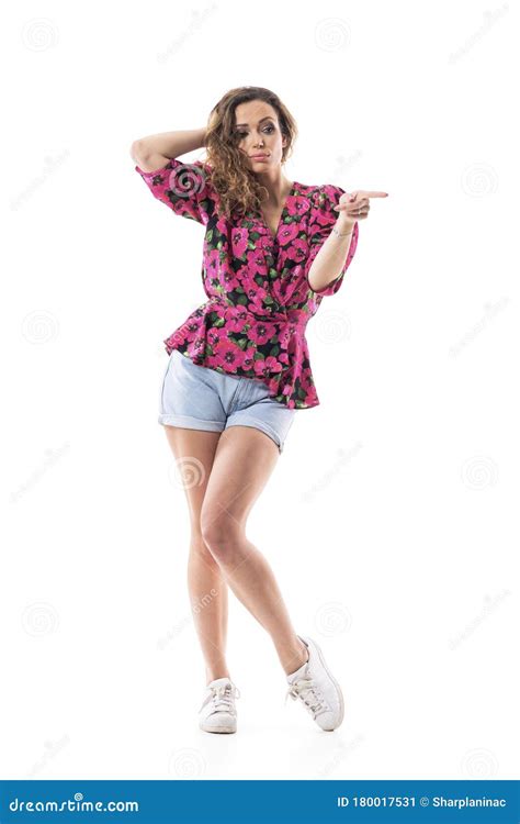 Cocky Woman With Attitude Touching Hair Looking Away Pointing Finger Advertising Stock Image