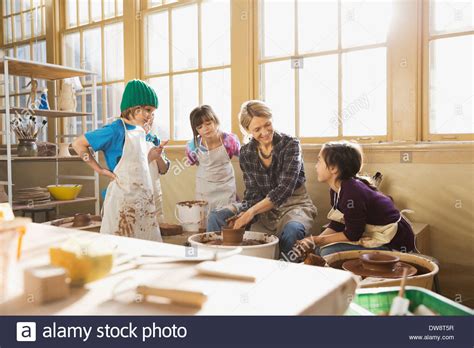 Students With Teacher In Pottery Class Stock Photo Alamy