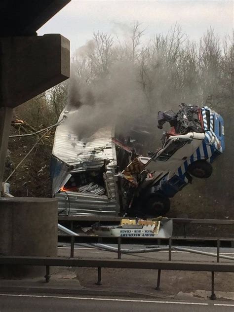 Terrified Drivers Watch Lorry Crash Off Bridge Onto A12 And Burst Into