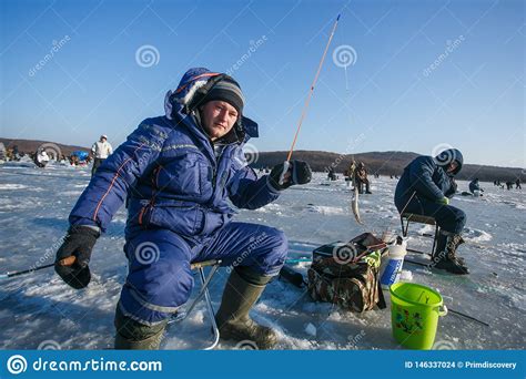 Men Sit On The Ice And Fish Winter Fishing In Russia Editorial Stock
