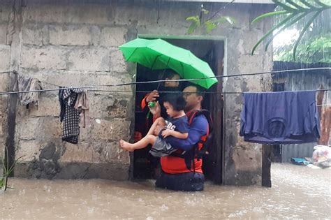 rain and floods in philippines leave 32 dead and others missing