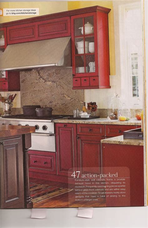Kitchen cabinets are white and the kitchen floors are black. Red and Yellow Kitchen Ideas | Red Kitchen | Trendy ...